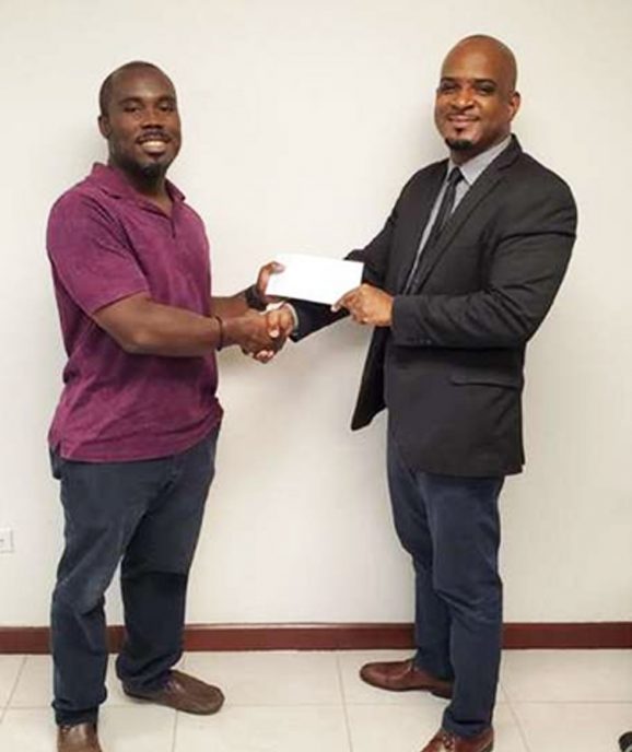 Mr. Nicholas Kirton (Left, BWA Engineer) and Dr. Kirk Douglas (Director, CBS). Winner of the WSRN-S biosecurity training video competition among BWA staff presented with a $100 supermarket voucher.